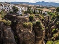 Residential apartments crowd the El Tajo chasm, Ronda, Spain, Espana